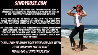 Anal pirate Sindy Rose ruin her ass with curvy huge black dildo on the beach